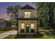 Stylish two-story home featuring a cozy front porch and a green lawn at 1473 Lansing Se St, Atlanta, GA 30315