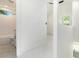 Hallway featuring an entry into bathroom and a view into another room at 1473 Lansing Se St, Atlanta, GA 30315