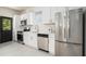 Modern kitchen with stainless steel appliances, white cabinetry, and a contemporary design at 1473 Lansing Se St, Atlanta, GA 30315