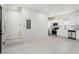 Bright, open concept kitchen with white cabinets, stainless steel appliances, and modern finishes at 1473 Lansing Se St, Atlanta, GA 30315
