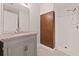 Modern bathroom featuring updated vanity, granite countertop and tiled shower at 211 Millstone Dr, Hampton, GA 30228