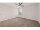 Bedroom with plush carpet, ceiling fan and natural light from window at 211 Millstone Dr, Hampton, GA 30228