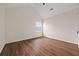 Bedroom with ceiling fan, neutral walls, and modern wood-look flooring at 211 Millstone Dr, Hampton, GA 30228