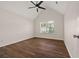 Bedroom with vaulted ceiling, fan, window, and dark wood floors in a comfortable space at 211 Millstone Dr, Hampton, GA 30228