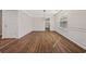 Dining area with modern light fixture, hardwood floors, and detailed wall trim at 211 Millstone Dr, Hampton, GA 30228