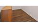 Close-up on modern wood-look flooring with white trim in a hallway at 211 Millstone Dr, Hampton, GA 30228