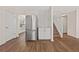 Bright kitchen features stainless steel refrigerator, white cabinets and subway tile backsplash at 211 Millstone Dr, Hampton, GA 30228