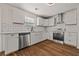 Well-lit kitchen featuring white cabinetry, stainless steel appliances, and subway tile backsplash at 211 Millstone Dr, Hampton, GA 30228