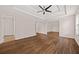 Large main bedroom with tray ceiling and door leading to additional room or closet at 211 Millstone Dr, Hampton, GA 30228