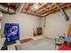 Unfinished basement featuring concrete walls, ductwork, art, and a storage area at 2115 Howell Mill Nw Rd, Atlanta, GA 30318