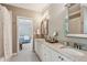 Charming bathroom with double sinks, granite countertops, and a view into an adjacent bedroom at 2115 Howell Mill Nw Rd, Atlanta, GA 30318