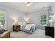 Comfortable bedroom with a cozy armchair, natural light, and a serene atmosphere with soft tones at 2115 Howell Mill Nw Rd, Atlanta, GA 30318