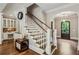 Elegant entryway with hardwood floors, staircase, and decorative details at 2115 Howell Mill Nw Rd, Atlanta, GA 30318