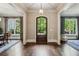 Grand foyer with hardwood floors, decorative lighting, and views into living and dining spaces at 2115 Howell Mill Nw Rd, Atlanta, GA 30318
