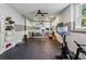 Spacious home gym with mirrored wall, exercise equipment, and rubber flooring at 2115 Howell Mill Nw Rd, Atlanta, GA 30318