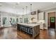 Gourmet kitchen with a large island, stainless steel appliances, and a breakfast nook with backyard views at 2115 Howell Mill Nw Rd, Atlanta, GA 30318