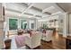 Open concept living room with coffered ceilings, large windows, and hardwood floors at 2115 Howell Mill Nw Rd, Atlanta, GA 30318
