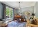 Cozy living room with hardwood floors, piano, and comfortable seating at 2115 Howell Mill Nw Rd, Atlanta, GA 30318