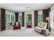 Bright sitting room with hardwood floors, natural light, and comfortable armchairs at 2115 Howell Mill Nw Rd, Atlanta, GA 30318