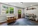 Bright studio space with large window, wood door, and storage on rolling casters at 2115 Howell Mill Nw Rd, Atlanta, GA 30318