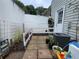 Cozy backyard with a small garden area, brick pathway, and outdoor seating at 4312 Idlewood Ln, Tucker, GA 30084