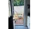 View from inside the home showing a backyard with a small patio and garden beds at 4312 Idlewood Ln, Tucker, GA 30084