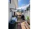 Backyard with a patio, outdoor seating, shed, AC unit and various items stored around at 4312 Idlewood Ln, Tucker, GA 30084
