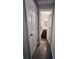 Hallway view into a bathroom featuring a vanity and toilet at 4312 Idlewood Ln, Tucker, GA 30084