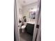 Cozy bathroom featuring an elegant vanity and toilet, complemented by stylish wall art at 4312 Idlewood Ln, Tucker, GA 30084