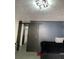 Bedroom featuring modern gray sliding barn door, contemporary blue accent wall and updated lighting at 4312 Idlewood Ln, Tucker, GA 30084