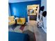 Stylish bedroom featuring colorful walls, seating area, and en-suite bathroom access at 4312 Idlewood Ln, Tucker, GA 30084