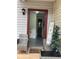 Charming entryway with cozy seating, decorative accents, and view to half bathroom at 4312 Idlewood Ln, Tucker, GA 30084