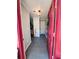 Inviting foyer with gray tile flooring and a red front door at 4312 Idlewood Ln, Tucker, GA 30084