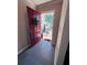 Home entrance with gray tile flooring and a red front door at 4312 Idlewood Ln, Tucker, GA 30084
