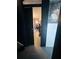A hallway leads to the room with gray flooring and white wall color at 4312 Idlewood Ln, Tucker, GA 30084