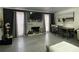 Inviting living room boasts a stone fireplace, TV, gray flooring, and plenty of natural light at 4312 Idlewood Ln, Tucker, GA 30084
