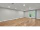 A finished basement with hardwood floors, recessed lighting and French doors at 4070 Feather Dr, Douglasville, GA 30135