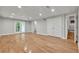 A finished basement with hardwood floors, recessed lighting and French doors at 4070 Feather Dr, Douglasville, GA 30135