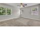 Sun-filled bedroom features neutral carpet and paint and double windows at 4070 Feather Dr, Douglasville, GA 30135
