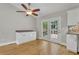 Charming dining area featuring hardwood floors, stylish cabinets, and French doors leading to a private outdoor deck at 4070 Feather Dr, Douglasville, GA 30135