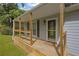 Cozy front porch with wooden railings and a decorative welcome mat, creating a warm and inviting entrance at 4070 Feather Dr, Douglasville, GA 30135