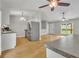 Open floor plan featuring kitchen with stainless steel appliances and hardwood floors at 4070 Feather Dr, Douglasville, GA 30135