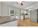 Bright eat-in kitchen features stainless steel appliances, white cabinets, and French door to backyard deck at 4070 Feather Dr, Douglasville, GA 30135