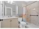 Well-lit bathroom featuring a modern vanity, toilet, and walk-in shower at 7030 Mandevilla Ln, Douglasville, GA 30135