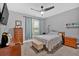 Cozy bedroom with a ceiling fan and a window that provides natural light at 7030 Mandevilla Ln, Douglasville, GA 30135