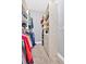 Walk-in closet featuring built-in shelving and hanging racks at 7030 Mandevilla Ln, Douglasville, GA 30135