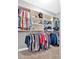 Walk-in closet with built-in shelving and ample storage space at 7030 Mandevilla Ln, Douglasville, GA 30135