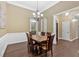 Traditional dining room featuring wood table, chandelier, and natural lighting at 7030 Mandevilla Ln, Douglasville, GA 30135