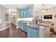 Charming kitchen featuring bright cabinetry, stainless steel appliances, and an eat-in counter area at 7030 Mandevilla Ln, Douglasville, GA 30135
