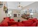 Cozy living room featuring a fireplace, comfortable seating, and abundant natural light at 7030 Mandevilla Ln, Douglasville, GA 30135